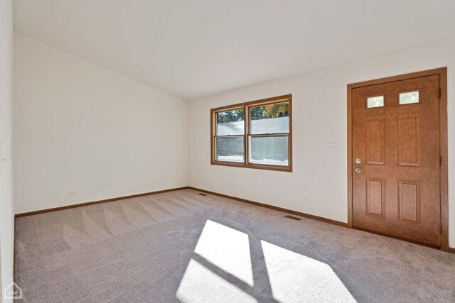 foyer with light carpet