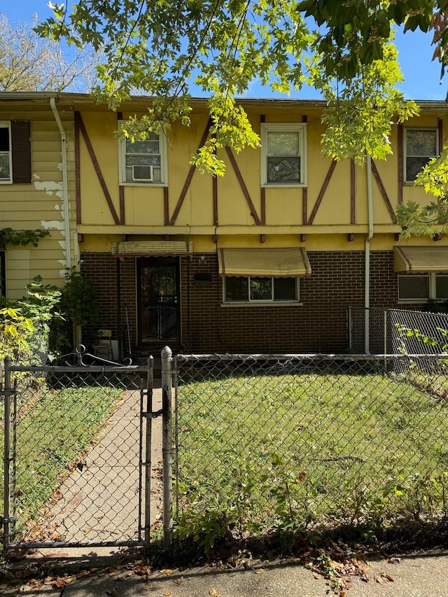 english style home with a front yard