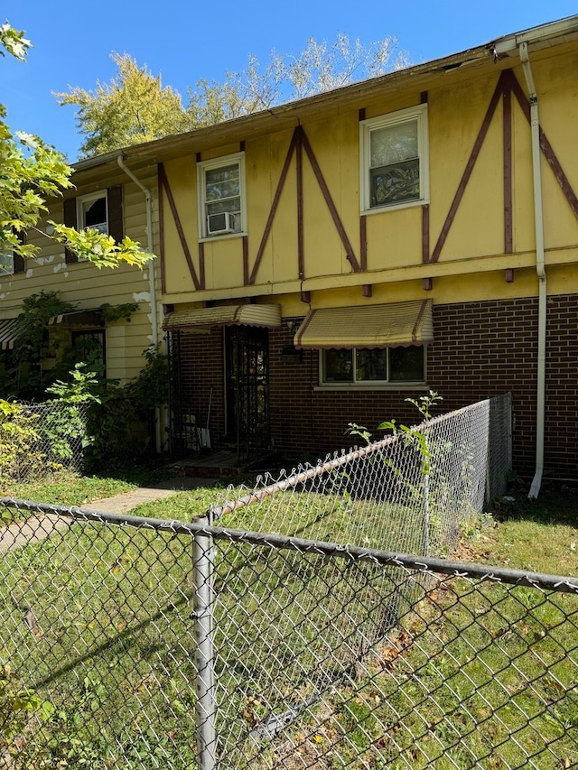 exterior space with a yard and cooling unit