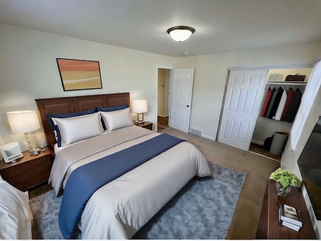 bedroom featuring a spacious closet and a closet