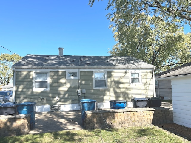 back of house with a patio area