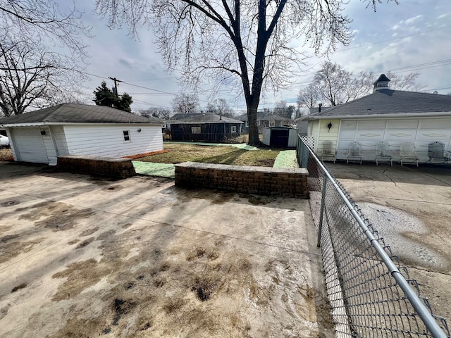 view of patio / terrace featuring a garage and an outdoor structure