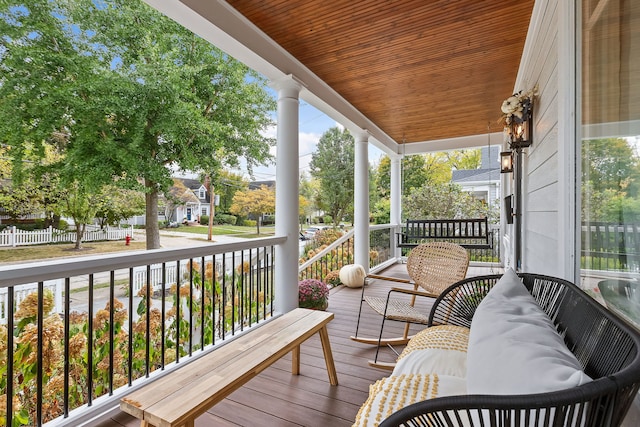 wooden terrace featuring covered porch