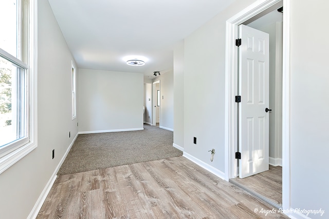 spare room featuring light wood-type flooring