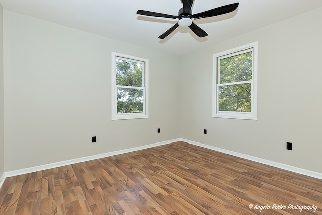 empty room featuring wood-type flooring and ceiling fan