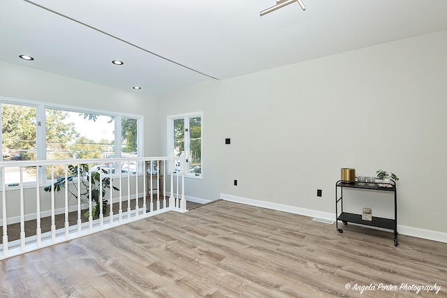 unfurnished room with light hardwood / wood-style flooring