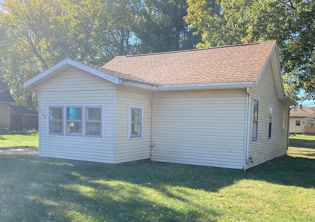 view of home's exterior with a lawn