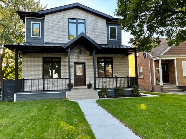 view of front of home with a front lawn and a porch