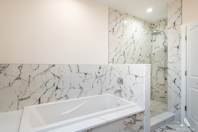 bathroom featuring tile walls and shower with separate bathtub