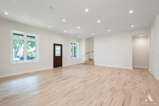 unfurnished living room with light hardwood / wood-style flooring