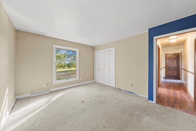 unfurnished bedroom with a closet and carpet