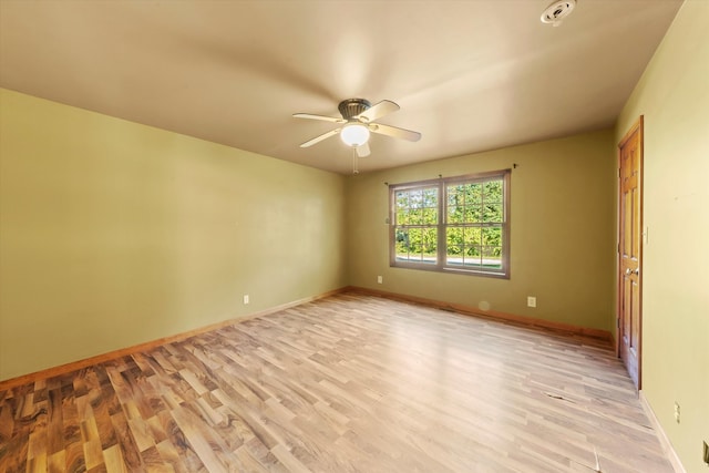 empty room featuring light hardwood / wood-style flooring and ceiling fan