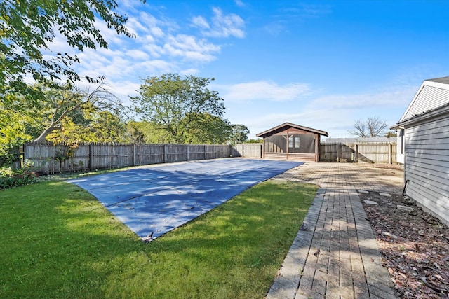 view of basketball court featuring a lawn