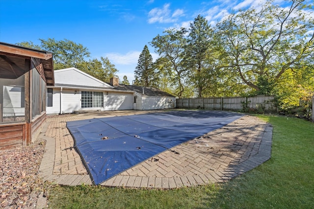 view of pool featuring a yard and a patio area