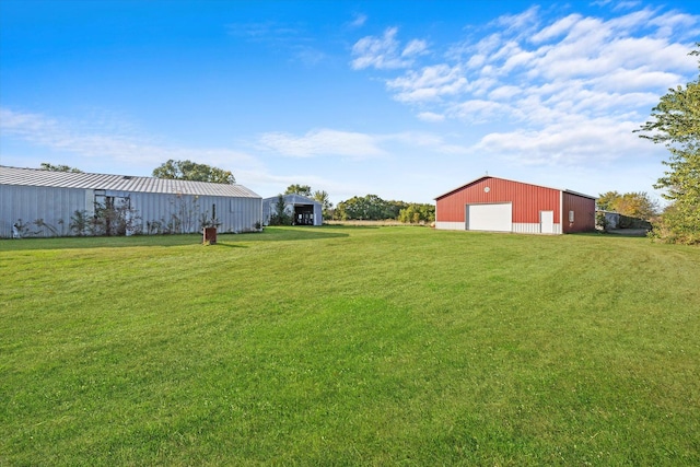 1940 W Eagle Lake Rd, Beecher, IL 60401 - view of yard featuring a detached garage, an outbuilding, and driveway