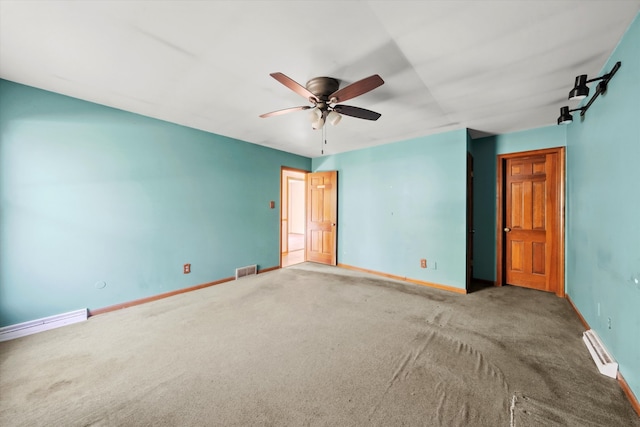 unfurnished bedroom with ceiling fan, carpet floors, and a baseboard radiator