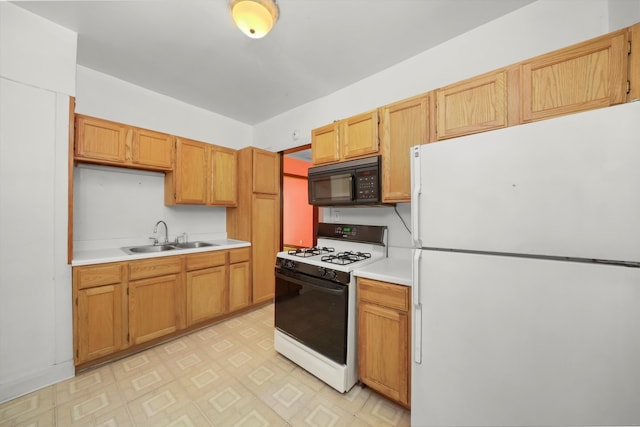 kitchen with sink and white appliances