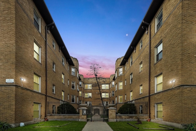 view of outdoor building at dusk