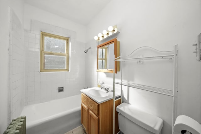 full bathroom with toilet, tile patterned flooring, tiled shower / bath combo, vanity, and radiator heating unit