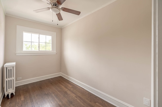 spare room with ornamental molding, ceiling fan, radiator, and dark hardwood / wood-style floors