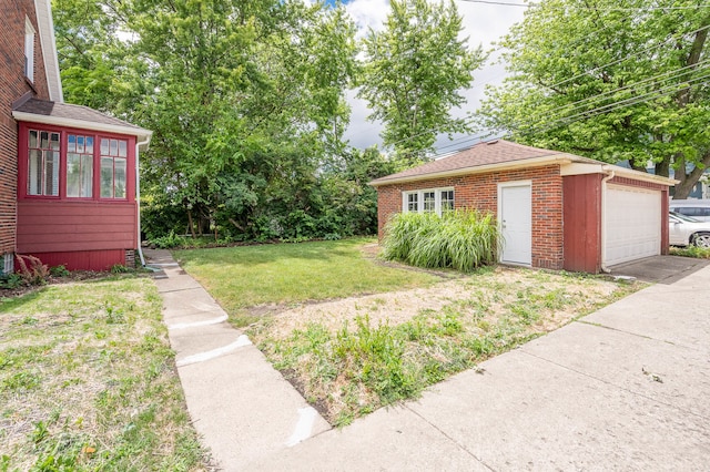 view of yard featuring a garage and an outdoor structure