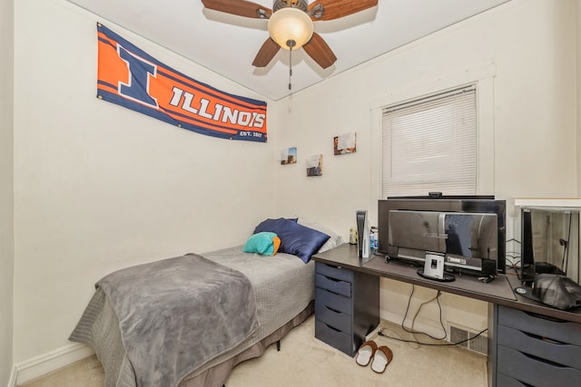 bedroom with carpet floors, crown molding, and ceiling fan