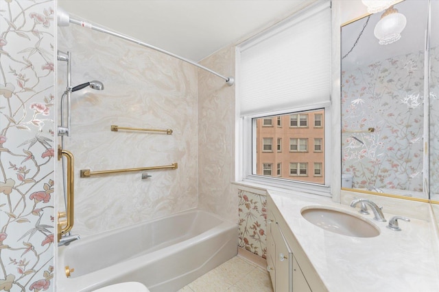 bathroom featuring tile patterned floors, vanity, and tiled shower / bath combo