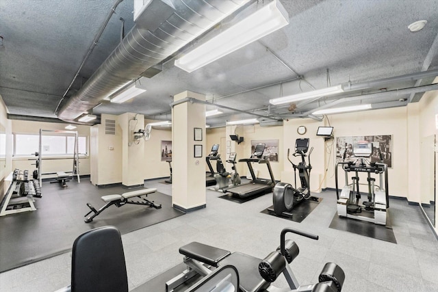 workout area featuring a textured ceiling