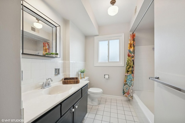 full bathroom featuring vanity, shower / bath combination with curtain, tile patterned floors, and toilet