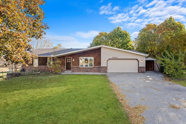 ranch-style home with a front yard and a garage