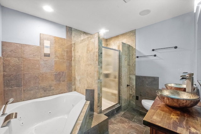 full bathroom with toilet, sink, and independent shower and bath