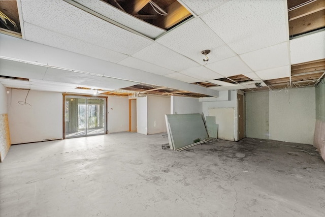 basement featuring a paneled ceiling