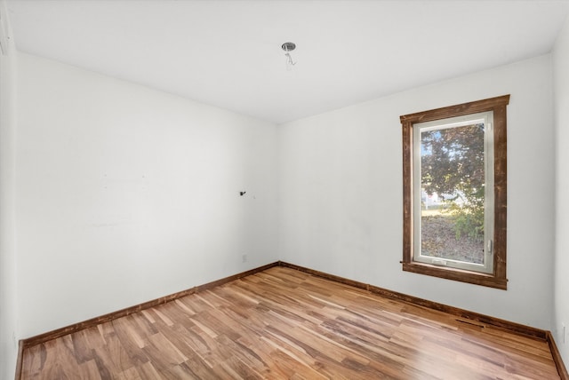 empty room with light hardwood / wood-style floors