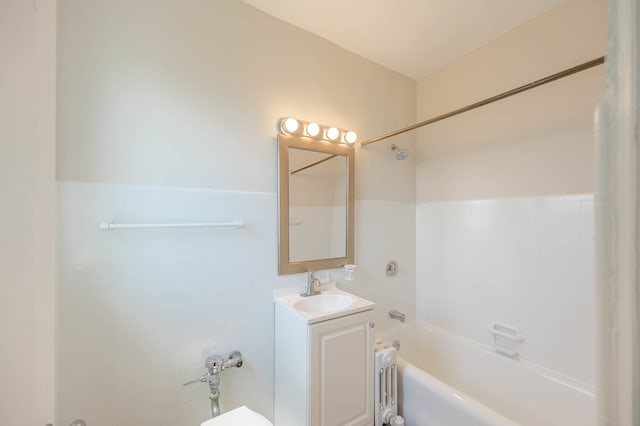 full bathroom with a wainscoted wall, shower / tub combination, and vanity