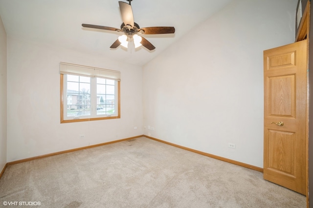 unfurnished room featuring vaulted ceiling, light colored carpet, and ceiling fan