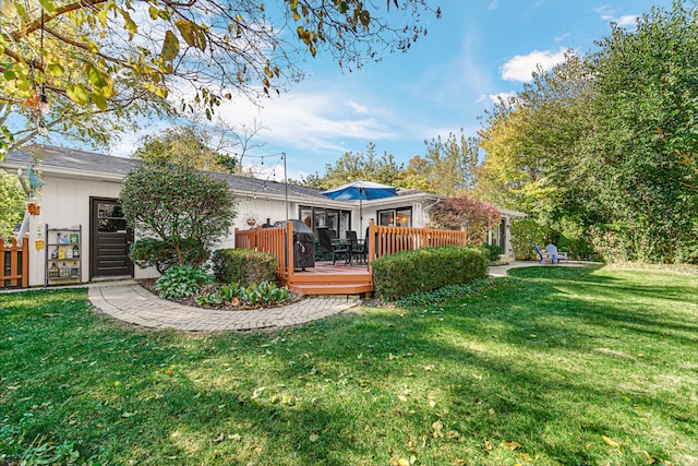 view of yard with a wooden deck