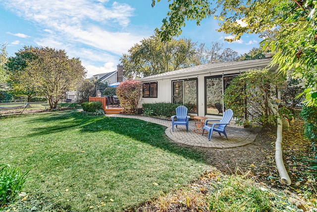 view of yard with a patio and a deck