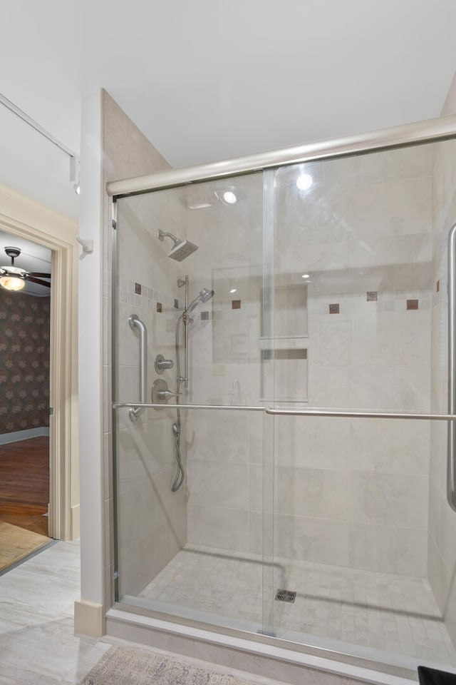 bathroom with a shower with shower door