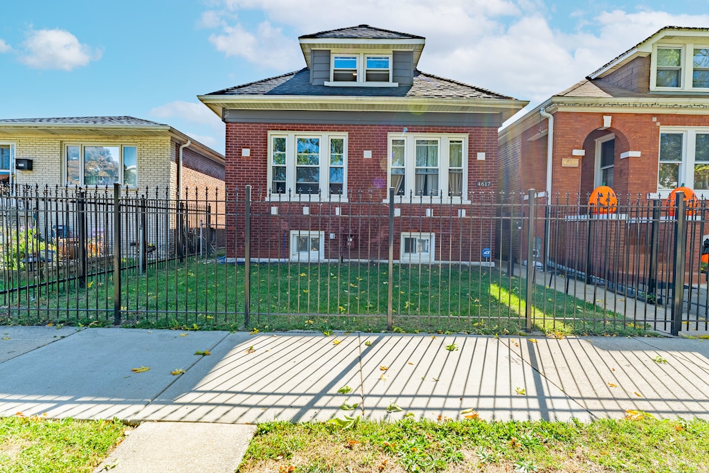 bungalow with a front yard