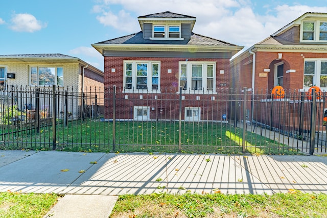 bungalow with a front yard