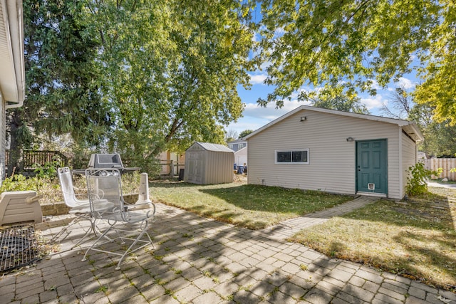 view of patio featuring a shed