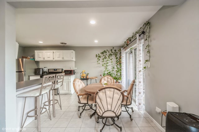 dining space with light tile patterned floors