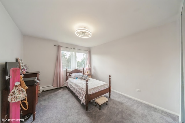 carpeted bedroom featuring a baseboard heating unit