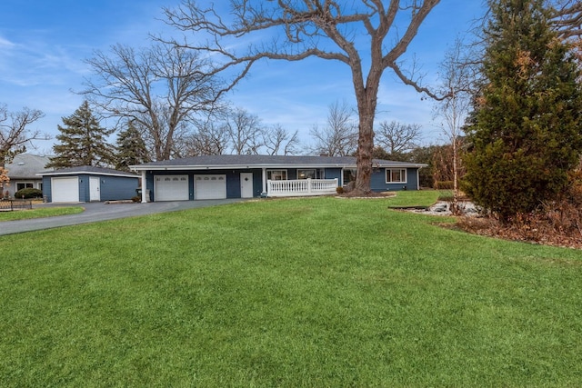 single story home featuring covered porch and a front lawn