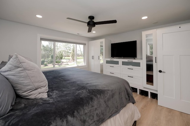 bedroom featuring light hardwood / wood-style floors and ceiling fan