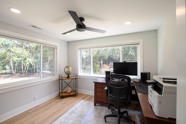 office space featuring ceiling fan and light wood-type flooring