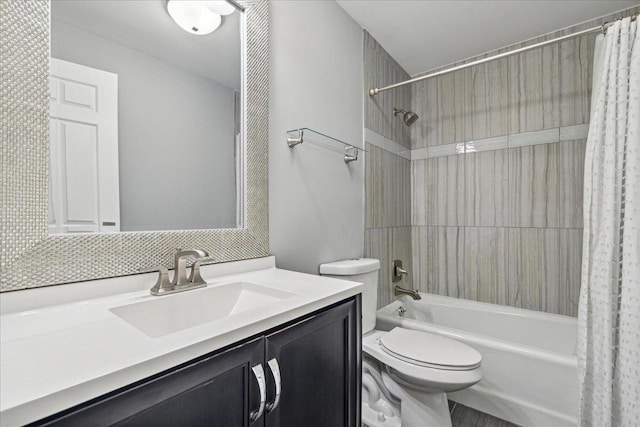 full bathroom with shower / bath combination with curtain, vanity, and toilet