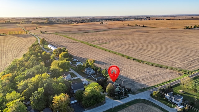 birds eye view of property with a rural view