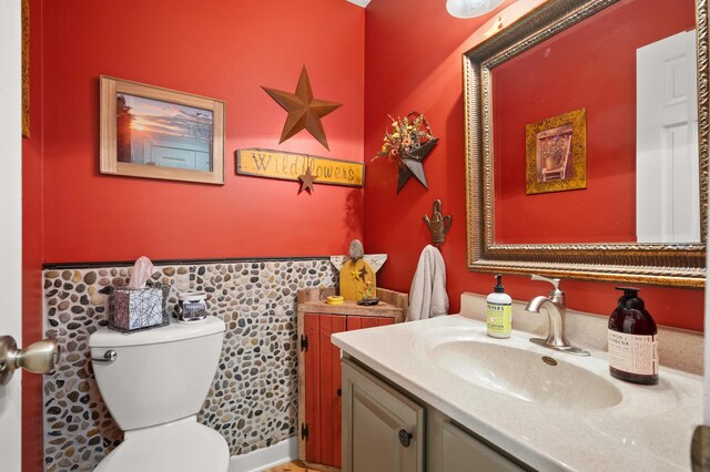 5995 W Clare Rd, Clare, IL 60111 - half bathroom featuring vanity and wainscoting