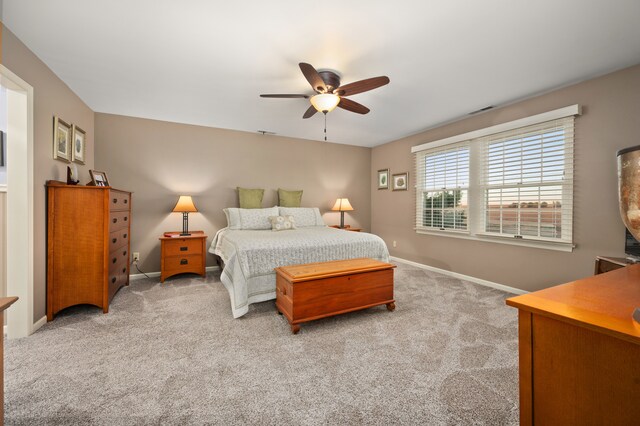 carpeted bedroom with ceiling fan